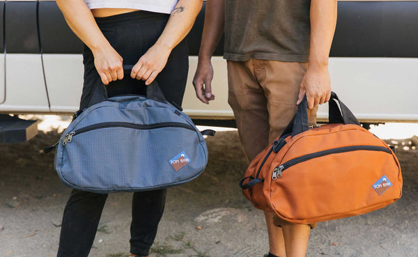 Person on the left is carrying an OSCA in Night Walk; person on the right is carrying an OSCA in Burnt Orange.